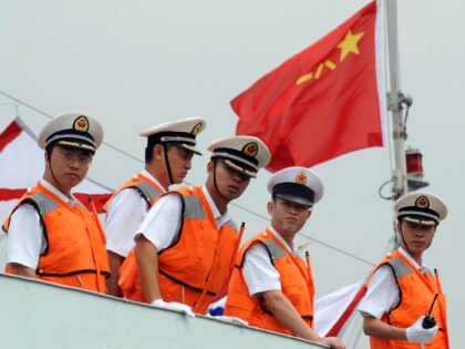 People's Liberation Army (PLA) Navy sailors stand on the deck of China's Task Force 525 fl