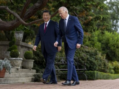 President Joe Biden and China's President Xi Jinping walk in the gardens at the Filol