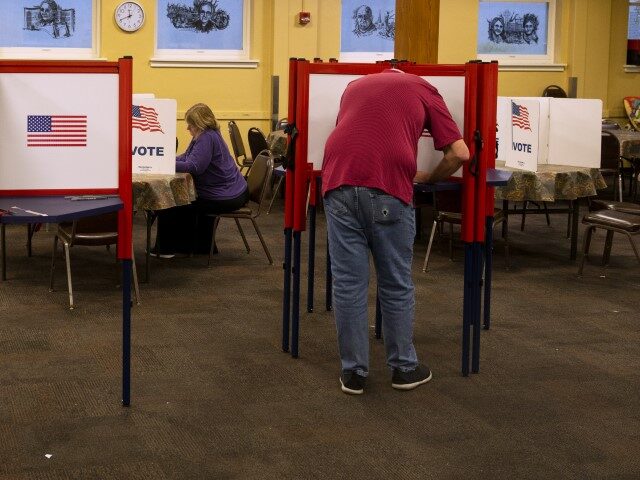 Voters cast their ballots at Highland Baptist Church on November 7, 2023, in Louisville, K