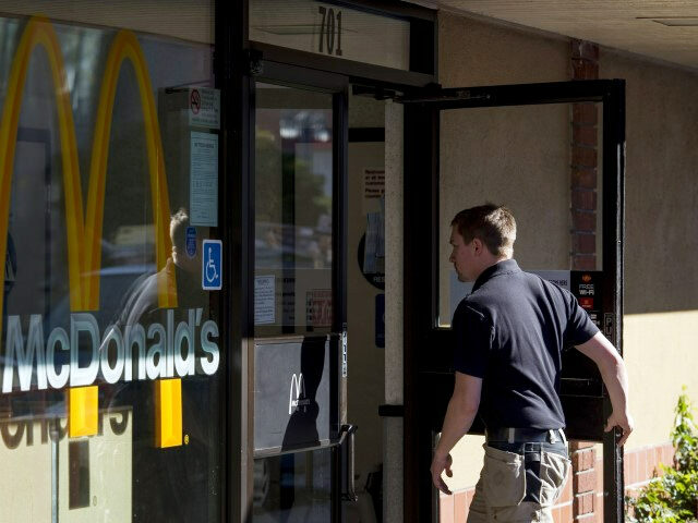 A customer enters a McDonald's Corp. restaurant in San Pablo, California, U.S., on Wednesday, Jan. 22, 2014. McDonald's Corp., the worlds largest restaurant chain, posted fourth-quarter profit that was little changed from a year earlier as U.S. same-store sales fell amid shaky consumer confidence and increased competition. (David Paul Morris/Bloomberg …
