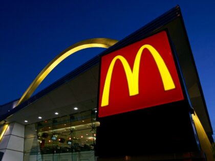 FILE - The McDonald's restaurant logo and golden arch is lit up, April 20, 2006, in Chicag