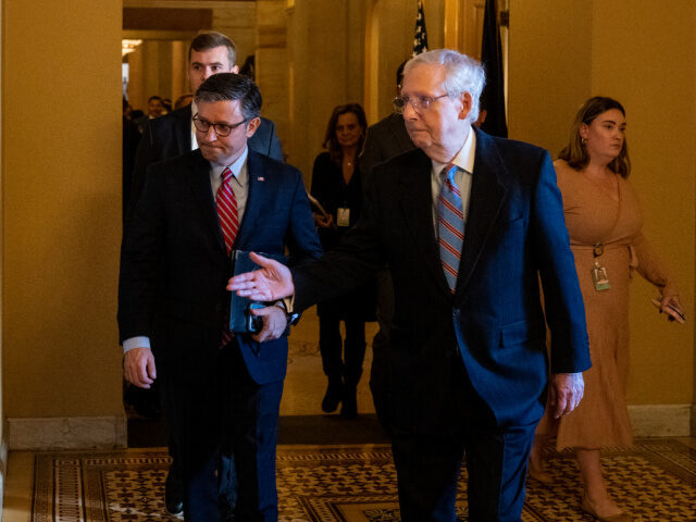 WASHINGTON - NOVEMBER 29: Senate Minority Leader Mitch McConnell, R-Ky., right, escorts Sp