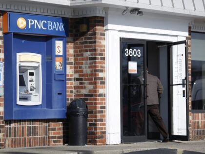 A customer enters a PNC Financial Services Group Inc. bank branch in Louisville, Kentucky,