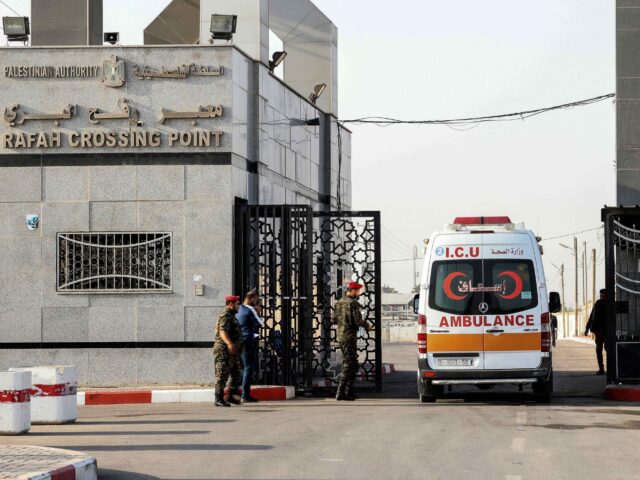 A ambulance crosses into Egypt through the Rafah border crossing in the southern Gaza Strip, on November 15, 2021. - Gaza, an impoverished territory of some two million people, where Hamas fought its most recent war with Israel in May, is a difficult place to enter or leave. This leaves …