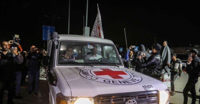 WATCH: Palestinians in Gaza City Taunt Red Cross Van Carrying Israeli Hostages