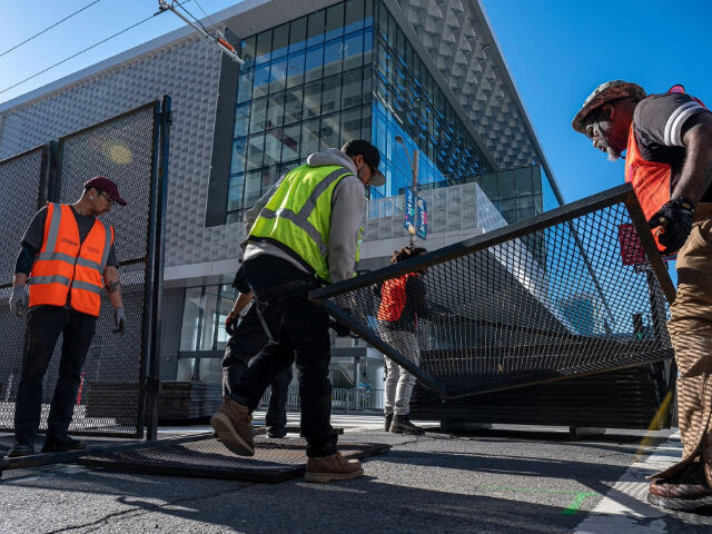 Contractors install temporary fencing near the Moscone Convention Center ahead of the Asia-Pacific Economic Cooperation (APEC) summit in San Francisco, California, US, on Sunday, Nov. 12, 2023. Next week's long-awaited gathering in San Francisco of leaders from the 21-member forum marks the first time the US has hosted the event …