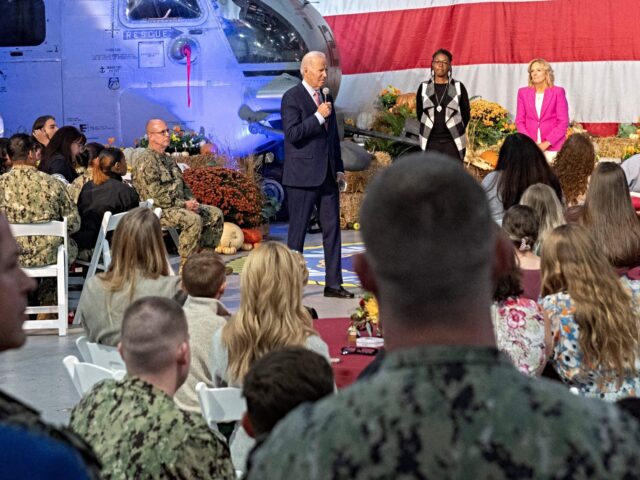 US President Joe Biden speaks at a Friendsgiving dinner with service members and military