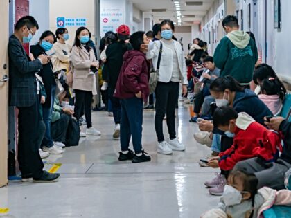 Parents with children who are suffering from respiratory diseases are lining up at a children's hospital in Chongqing, China, on November 23, 2023. (Photo by Costfoto/NurPhoto via Getty Images)