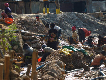 SOUTH KIVU, DEMOCRATIC REPUBLIC OF CONGO - JULY 14: Workers, including women and children, work in a cobalt mine through small-scale and non-corporate mining activities referred to as "artisanal" mining, carried out under very poor conditions, without any precautions and any control by any authority in the Mwenga territory of …