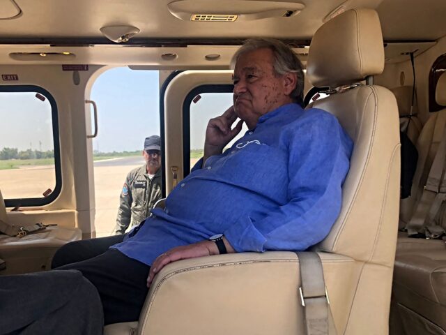 United Nations Secretary-General Antonio Guterres sits in a helicopter during his visit to