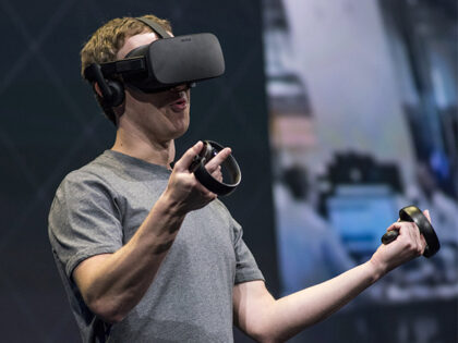 Mark Zuckerberg, chief executive officer and founder of Facebook Inc., demonstrates an Ocu
