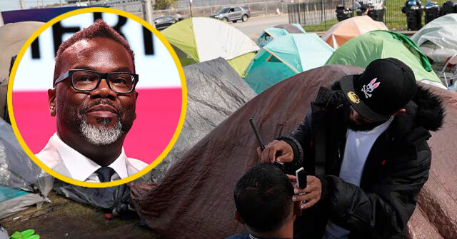 Workers Building Chicago's Migrant Tent Encampment Erect Screens so Work Cannot Be Seen