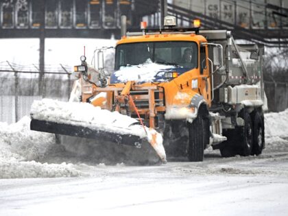 HAMBURG , NY - December 24: A plow removes ice and snow along the Lake Erie shoreline on December 24, 2022 in Hamburg, New York. The Buffalo suburb and surrounding area was hit hard by the winter storm Elliott with wind gusts over 70 miles per hour battering homes and …