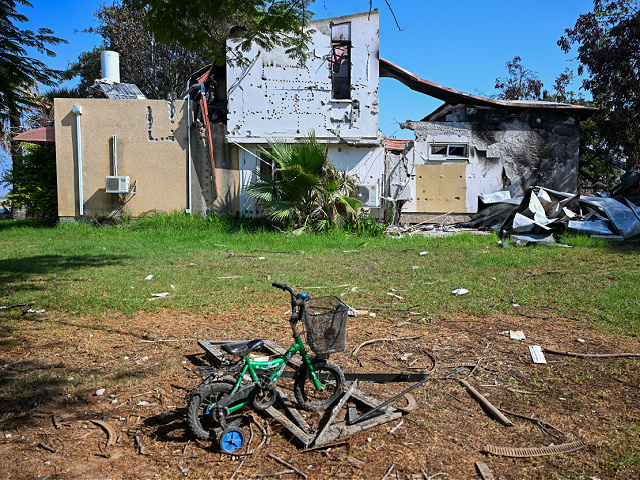 KISSUFIM, ISRAEL - NOVEMBER 01: A child's tricycle is seen left outside a partially destroyed house after Hamas militants attacked this kibbutz on October 7th near the border of Gaza, on November 01, 2023 in Kissufim, Israel. More than three weeks since Hamas's Oct 7 attacks in Israel, which killed 1,400 according to Israeli authorities, just over half have now been laid to rest, and over four-fifths have been identified. Volunteers continue to identify victims at the country's Shura military facility. (Photo by Alexi J. Rosenfeld/Getty Images)