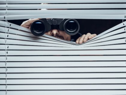 spy with binoculars