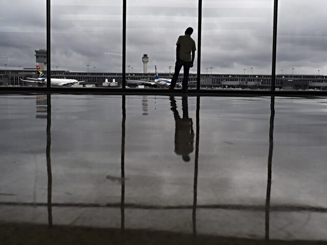 DULLES, VA - OCTOBER 16: Abera Lako, who works at Dulles International Airport looks out a