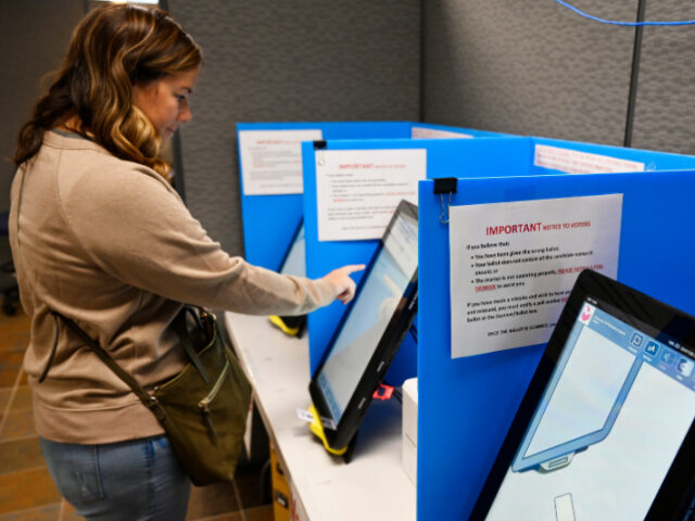 FILE-In this Tuesday, Nov. 5, 2019 file photoCourtney Parker votes on a new voting machine