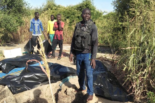 Body bags of farmers are lined up after an attack, by jihadists in northeast Nigeria's Zab