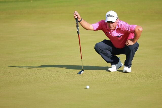 Cameron Percy of Australia lines up a putt on the way to the first-round lead in the US PG