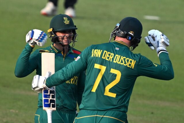 Century makers: South Africa's Quinton de Kock (left) celebrates with teammate Rassie van