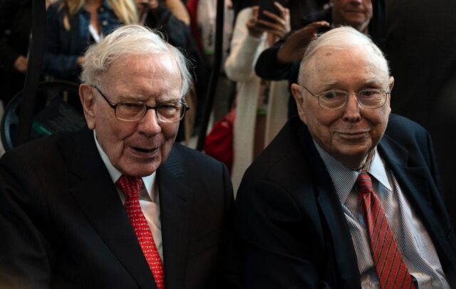 Charlie Munger (R) passed away at the age of 99, Berkshire Hathaway said