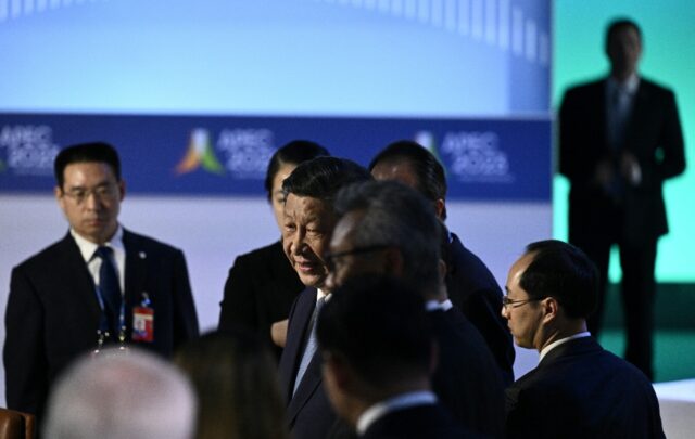 Chinese President Xi Jinping (C) said officials must ensure 'comprehensive, open and trans