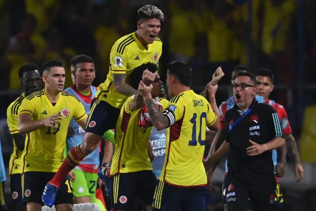 Colombia's Luis Diaz is mobbed by teammates after scoring twice in the 2-1 World Cup quali