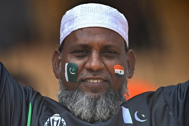 A fan with India's and Pakistan's national flags painted on his face at the World Cup