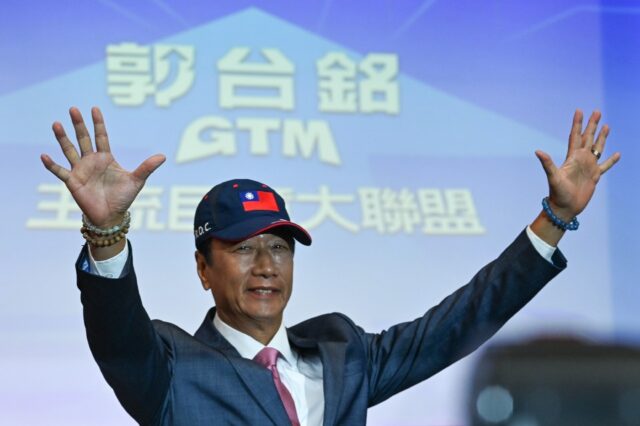 Foxconn founder Terry Gou waves during an August press conference in Taipei