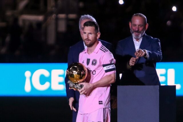 Inter Miami's Argentine forward Lionel Messi holds his eighth Ballon d’Or trophy prior t