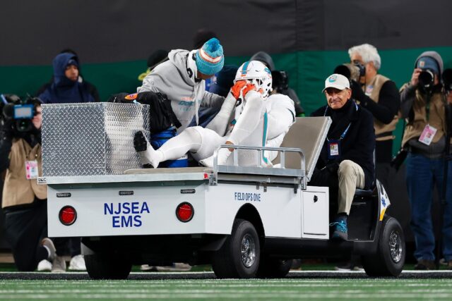 Jaelan Phillips of the Miami Dolphins is carted off the field after suffering a torn Achil