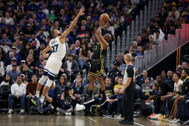 Minnesota's Rudy Gobert defends a shot by Golden State's Chris Paul in the Timberwolves' c