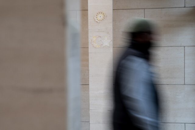 A member of the congregation departs Dar Al-Hijrah Islamic Center in Falls Church, one of the main mosques of northern Virginia