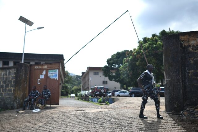 Police guard the entrance to the Sierra Leone Broadcasting Corporation in Freetown followi