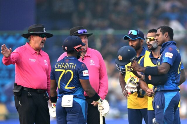 Out: Sri Lanka's Angelo Mathews listens to the umpires after he was timed out