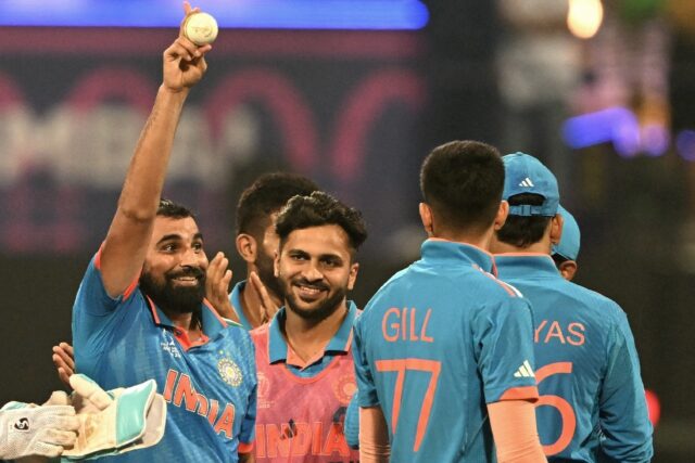 Five star: India's Mohammed Shami (L) celebrates after taking his fifth wicket against Sri Lanka