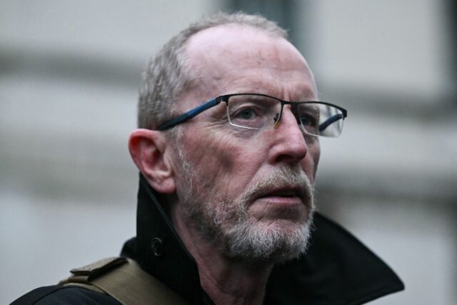 Thomas Hand, whose daughter is being held hostage by Hamas, attends a demonstration outsid