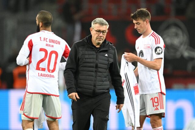 Urs Fischer (C) leaves the pitch after Union Berlin's defeat against Bayer Leverkusen on S