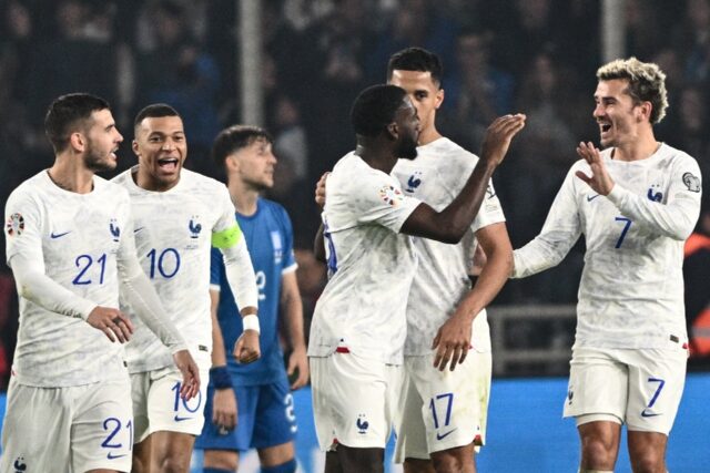 Youssouf Fofana (C) celebrates with his teammates after scoring France's equaliser in thei