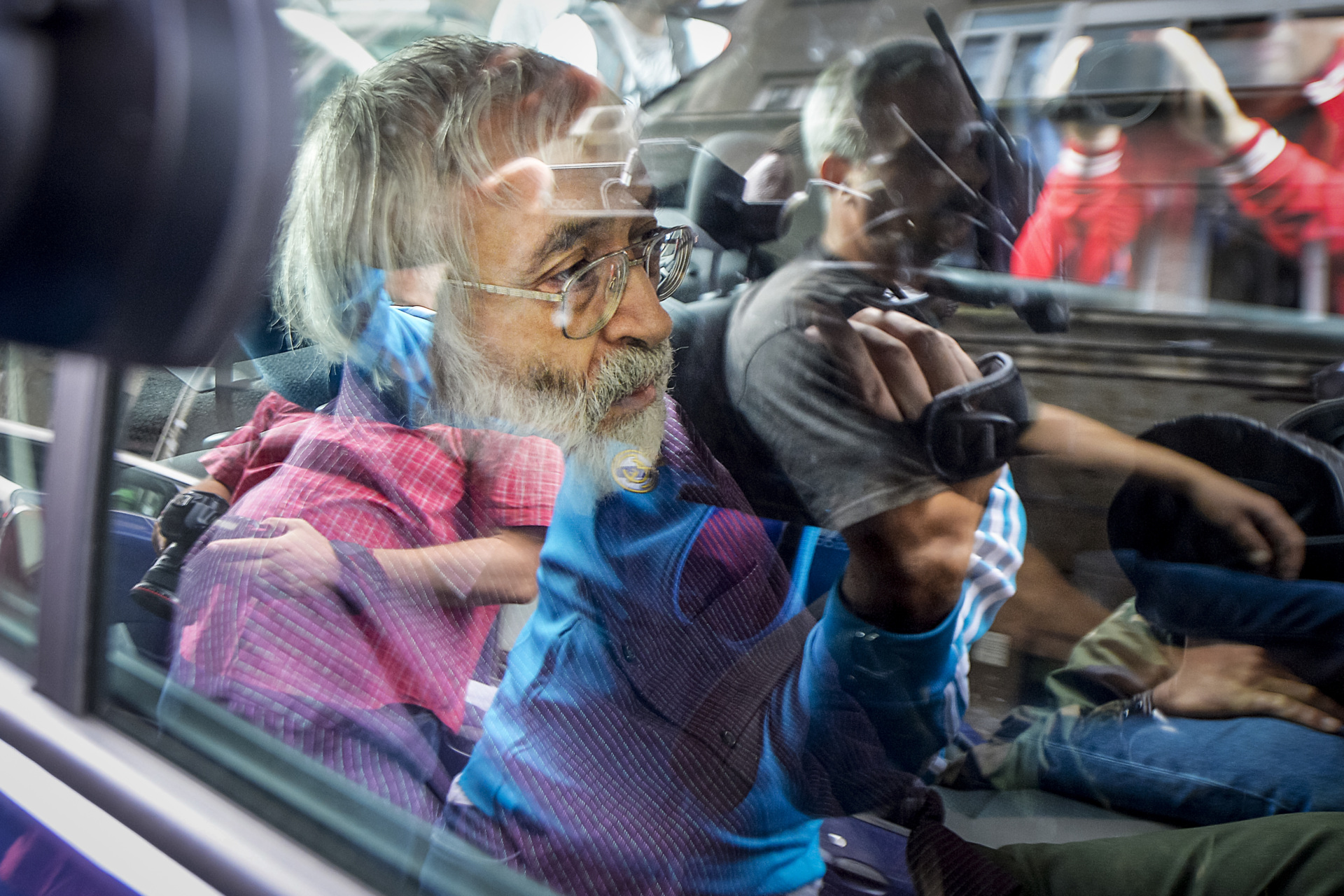 Romanian guru Gregorian Bivolaru sits in a vehicle, after a hearing at the Romanian Police headquarters in Bucharest, Romania, Wednesday, Aug. 24, 2016. French authorities arrested the leader of a multinational tantric yoga organization Tuesday Nov. 28, 2023 on suspicion of indoctrinating female followers for sexual exploitation. The Romanian guru at the heart of the Atman Yoga Federation was detained during a massive morning police operation across the Paris region. (AP Photo/Marian Ilie)