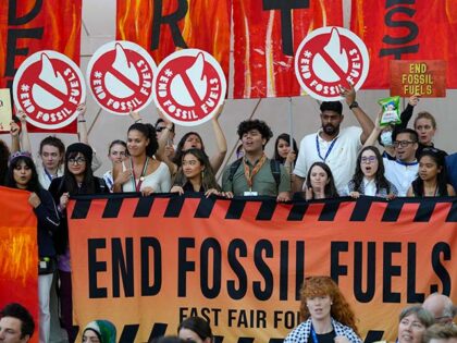 Activists participate in a demonstration against fossil fuels at the COP28 U.N. Climate Su