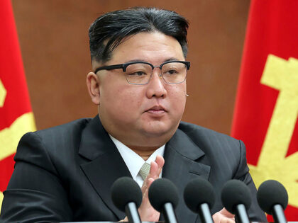 In this photo provided by the North Korean government, North Korean leader Kim Jong Un cla