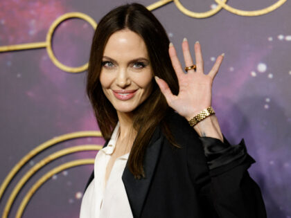 US actor Angelina Jolie poses on the blue carpet on arrival to attend the UK Gala Screenin