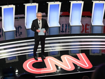 CNN journalist Wolf Blitzer arrives on stage to moderate the seventh Democratic primary de