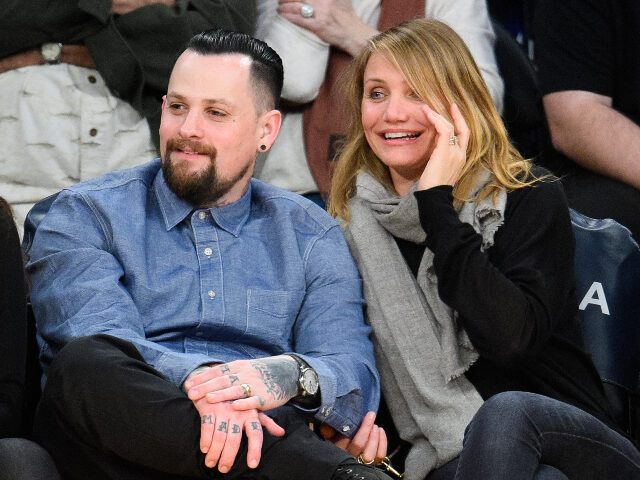 LOS ANGELES, CA - JANUARY 27: Benji Madden (L) and Cameron Diaz attend a basketball game b