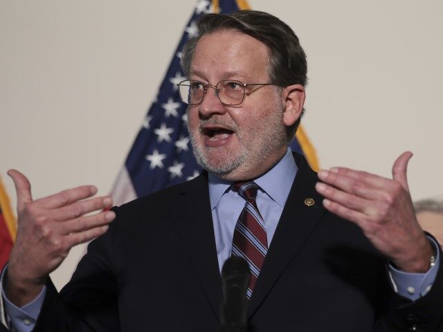 Sen. Gary Peters (D-MI) speaks during a press conference following the weekly Democratic c