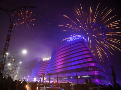 Pakistanis watch the fireworks display during the New Year celebrations in Rawalpindi on J