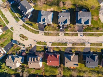 Top view directly above drone aerial view of the street in the residential neighborhood Li