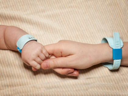 Newborn and mum with hospital bracelets