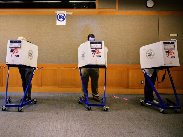 Voters stand in booths at a voting station at the Metropolitan Museum of Art (MET) during